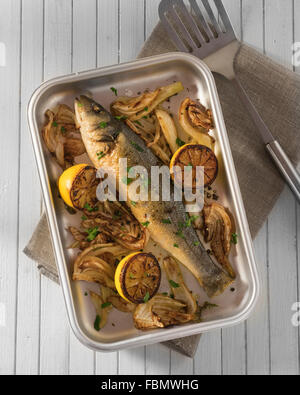 Baked sea bass with fennel and lemon Stock Photo
