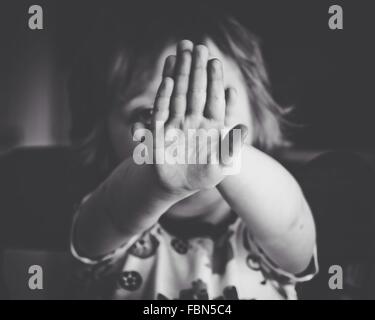 Close-Up Portrait Of Girl Hiding Face