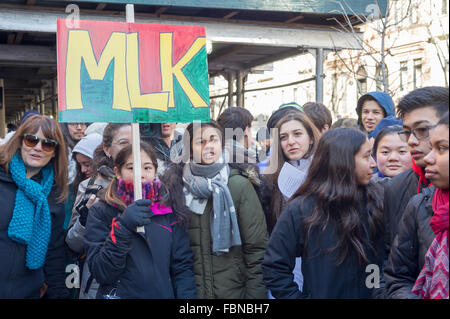 New York, USA. 18th January, 2016. Students from the Manhattan Country School with their families and friends participate in their 28th Annual Martin Luther King Jr. Commemorative Walk in New York, organized by the 8th Grade students, on Monday, January 18, 2016.  The walkers honored the memory of King in their march through the Upper West Side and Harlem stopping at various sites to read speeches and letters written by students. Credit:  Richard Levine/Alamy Live News Stock Photo