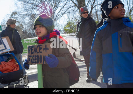 New York, USA. 18th January, 2016. Students from the Manhattan Country School with their families and friends participate in their 28th Annual Martin Luther King Jr. Commemorative Walk in New York, organized by the 8th Grade students, on Monday, January 18, 2016.  The walkers honored the memory of King in their march through the Upper West Side and Harlem stopping at various sites to read speeches and letters written by students. Credit:  Richard Levine/Alamy Live News Stock Photo