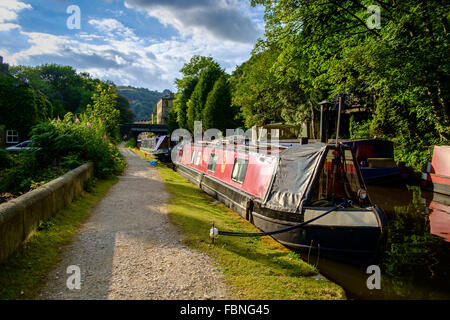 Moored barges on the Rochdale Canal in Hebden Bridge, West Yorkshire, England. Stock Photo