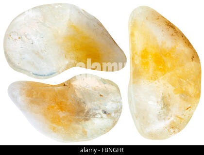 macro shooting of natural mineral stone - three yellow citrine gemstones isolated on white background Stock Photo