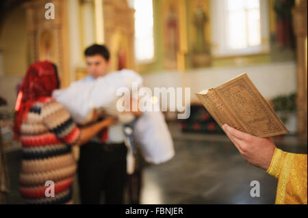 Holy orthodox book during christening baptism Stock Photo