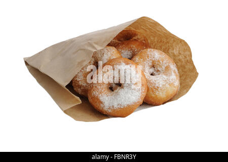 Fried donuts in a paper bag on white background (isolated) Stock Photo
