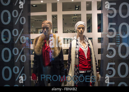 mannequins in a shop window with 50% sale. Stock Photo