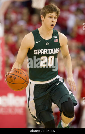 Matt McQuaid of the Michigan State Spartans dribbles up court during ...