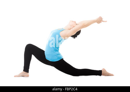 Sporty yogi girl doing exercises, asana Anjaneyasana, Low Lunge Yoga Pose, isolated on white background Stock Photo