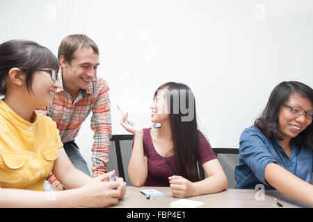 Business People Team Discussing Man Talking Asian Woman Stock Photo