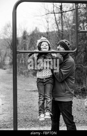 Father And Daughter Playing In Park