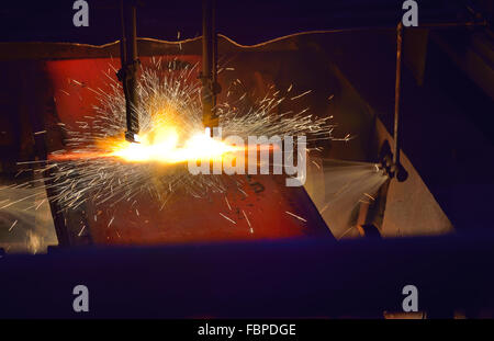 Gas cutting of the hot metal plate Stock Photo