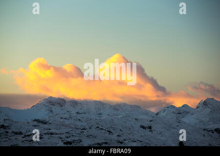 Warm light on Bow Fell and the Langdale Pikes in Langdale at sunset, Lake District, UK. Stock Photo