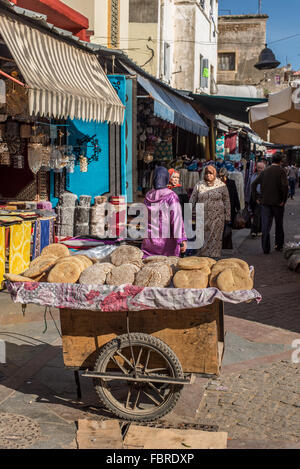 Fresh arabian bread (flatbread) on sale in a typical street market of Morocco. Stock Photo