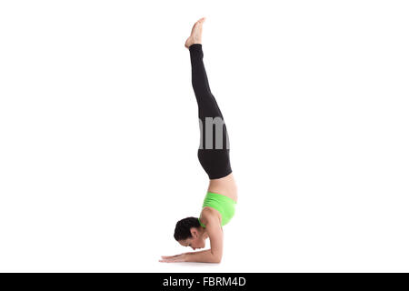 beautiful sporty girl doing handstand yoga asana feathered peacock fbrm4d