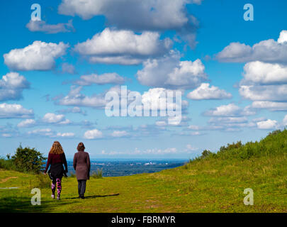 Two women walking at Devil's Punch Bowl a large natural amphitheatre and beauty spot near Hindhead Surrey England UK Stock Photo