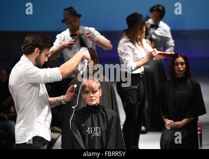 Berlin, Germany. 18th Jan, 2016. The hair of models are dressed by the hair-styling team of Dry Lounge on the runway at the 'Fashion Hall Part 5' event in Berlin, Germany, 18 January 2016. The Fall/Winter 2016/2017 collections are presented during the Berlin Fashion Week from 18 to 22 January. Photo: JENS KALAENE/dpa/Alamy Live News Stock Photo
