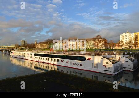 Two white hotel ships in the inland harbour with tenements at the bank of the Rhine in Cologne's district Deutz, 19 December 2013 Stock Photo