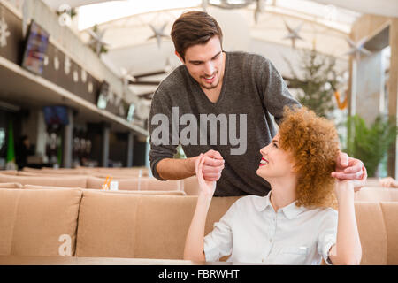 Portrait of a happy couple flirting in restaurant Stock Photo