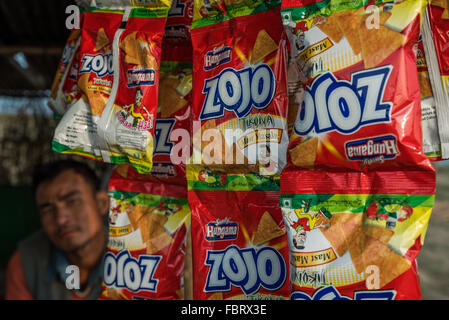 Strips of vibrant and appealing packets of dried savory snacks are available to buy at most stalls all over Assam and Nagaland. Stock Photo