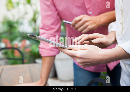Colleagues using digital tablet Stock Photo