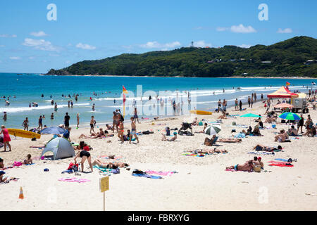 Byron bay and a busy Main Beach during summer with people sunbathing,  northern New South Wales,Australia Stock Photo