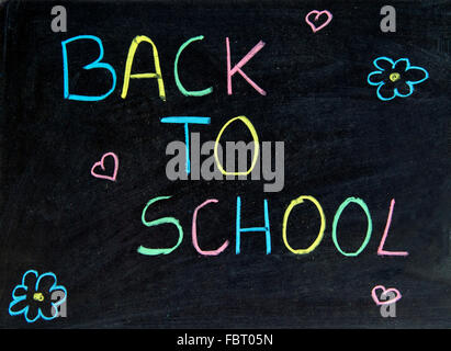 Written back to school on the blackboard Stock Photo