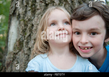 Boy with little sister, portrait Stock Photo