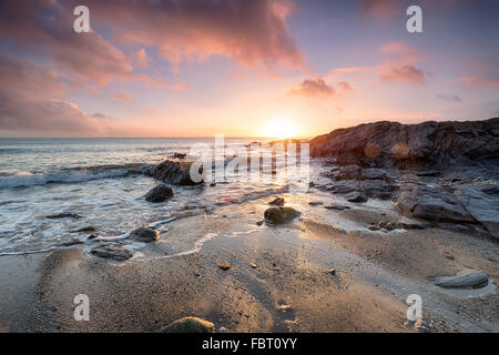 Stunning sunset over Hemmick Beach on the south coast of Cornwall Stock Photo