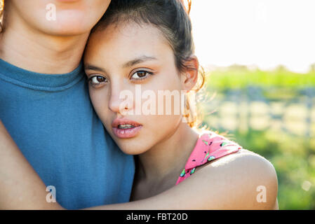 Young woman embracing boyfriend, portrait Stock Photo