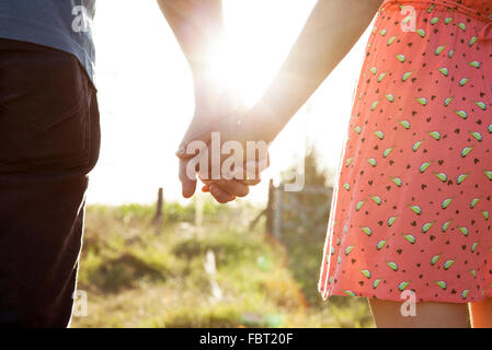 Couple holding hands, close-up Stock Photo