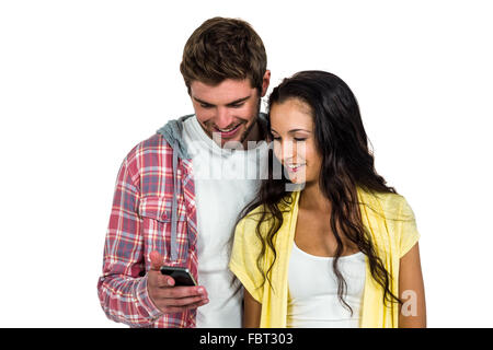 Smiling couple using smartphone together Stock Photo