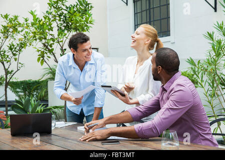 Business professionals having fun working together Stock Photo