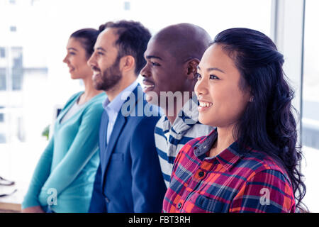Side view of happy business people in creative office Stock Photo