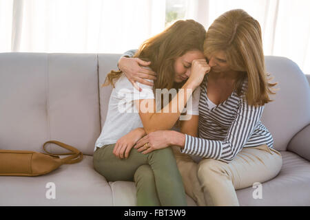 Mother comforting her teenage daughter Stock Photo