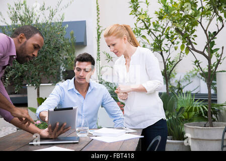 Presenting project proposal with digital tablet Stock Photo