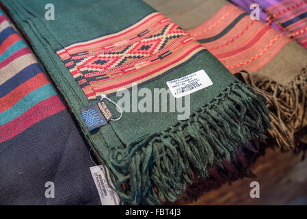 Indian market. An assortment of traditional vibrant textiles for sale in the market at the Naga Heritage Village. Nagaland, India. Stock Photo