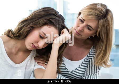 Sad daughter against mother Stock Photo