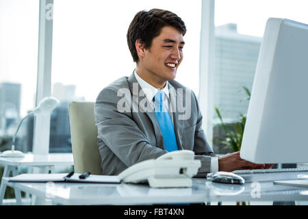 Businessman looking at computer Stock Photo