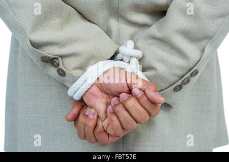 Businessman tied up in rope Stock Photo