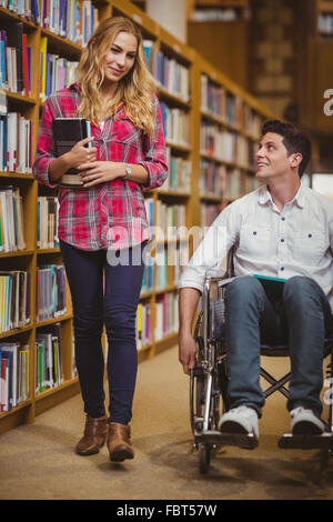 Student in wheelchair talking with classmate Stock Photo