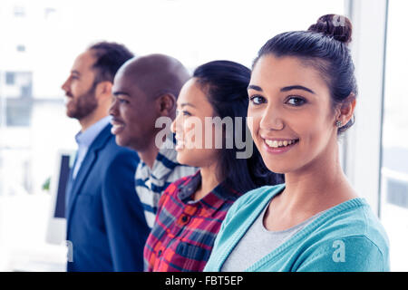 Portrait of attractive businesswoman with colleagues Stock Photo