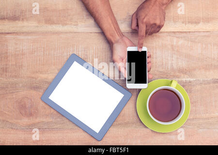 Cropped image of man using smart phone Stock Photo