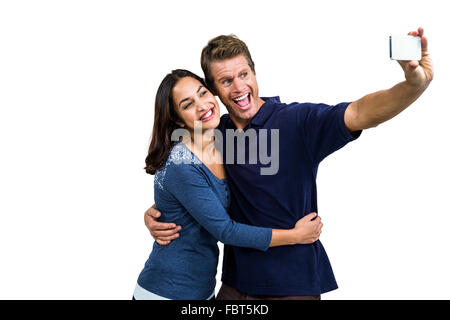 Cheerful young couple taking selfie Stock Photo
