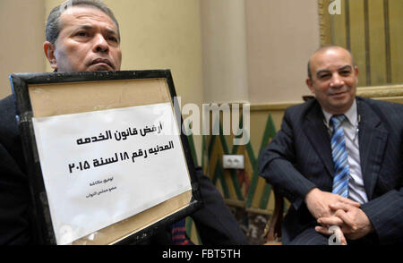 Cairo, Egypt. 19th Jan, 2016. Tawfiq Okasha, a pro-government TV anchorman who was elected to parliament, sits in an anteroom and holds banners against Civil Service Law during a parliamentary session, in Cairo, Egypt in Jan. 19, 2016 © Amr Sayed/APA Images/ZUMA Wire/Alamy Live News Stock Photo