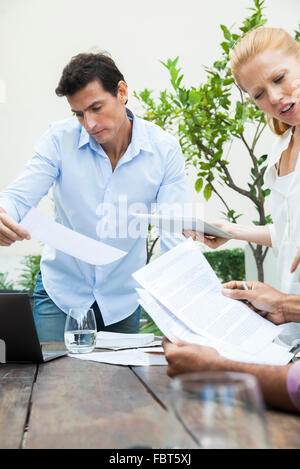 Business team reviewing documents Stock Photo
