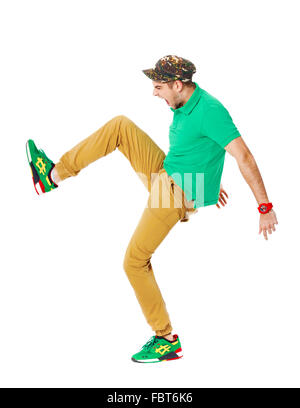 Fullbody portrait of young male kicking in studio isolated on white background. Stock Photo
