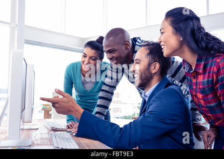 Cheerful businessman giving training to team Stock Photo