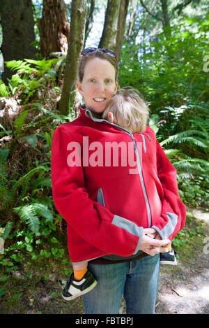 Woman hiking outdoors with young child Stock Photo