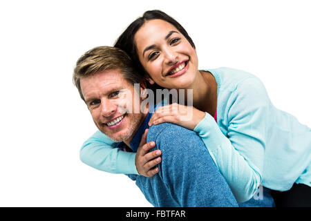 Cheerful man carrying girlfriend on back Stock Photo