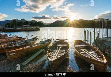 Wooden rowing boats with sunset sky Keswick Landing Stages Derwent Water Keswick Lake District Cumbria England UK GB EU Europe Stock Photo