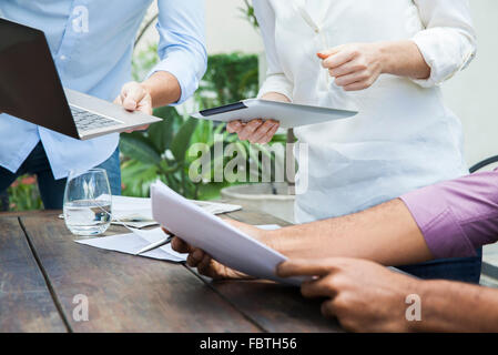 Laptop computers and digital tablets are valued tools in the business workplace Stock Photo
